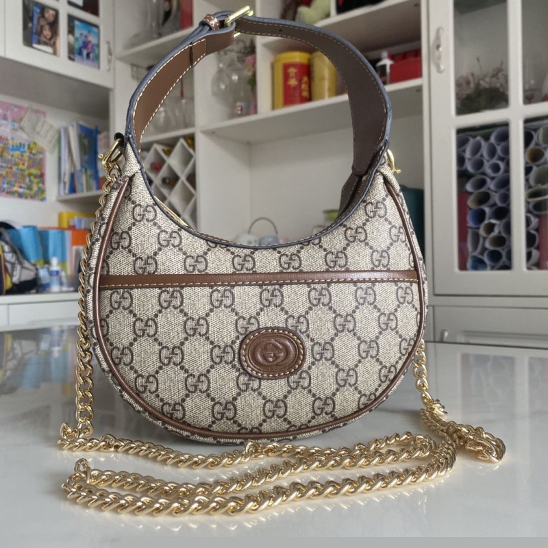 G*u*i top handle bags